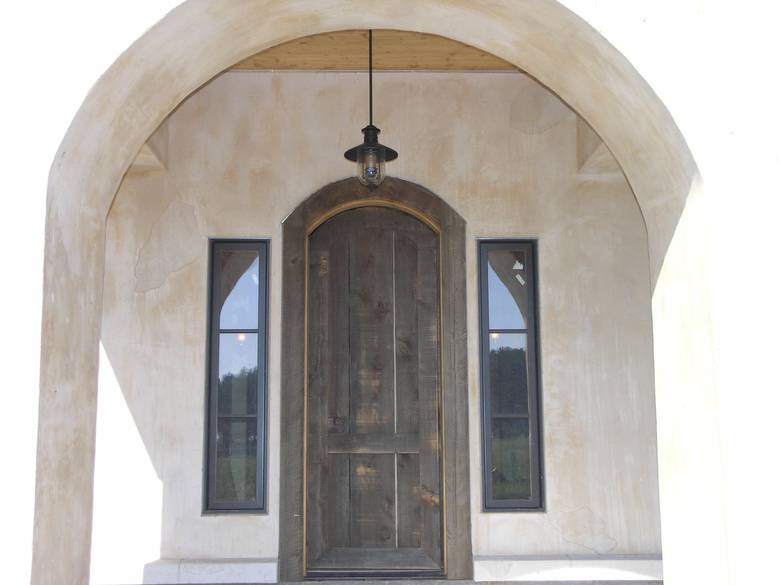 Spanish-Style Entryway / This door is constructed using coverboard barnwood